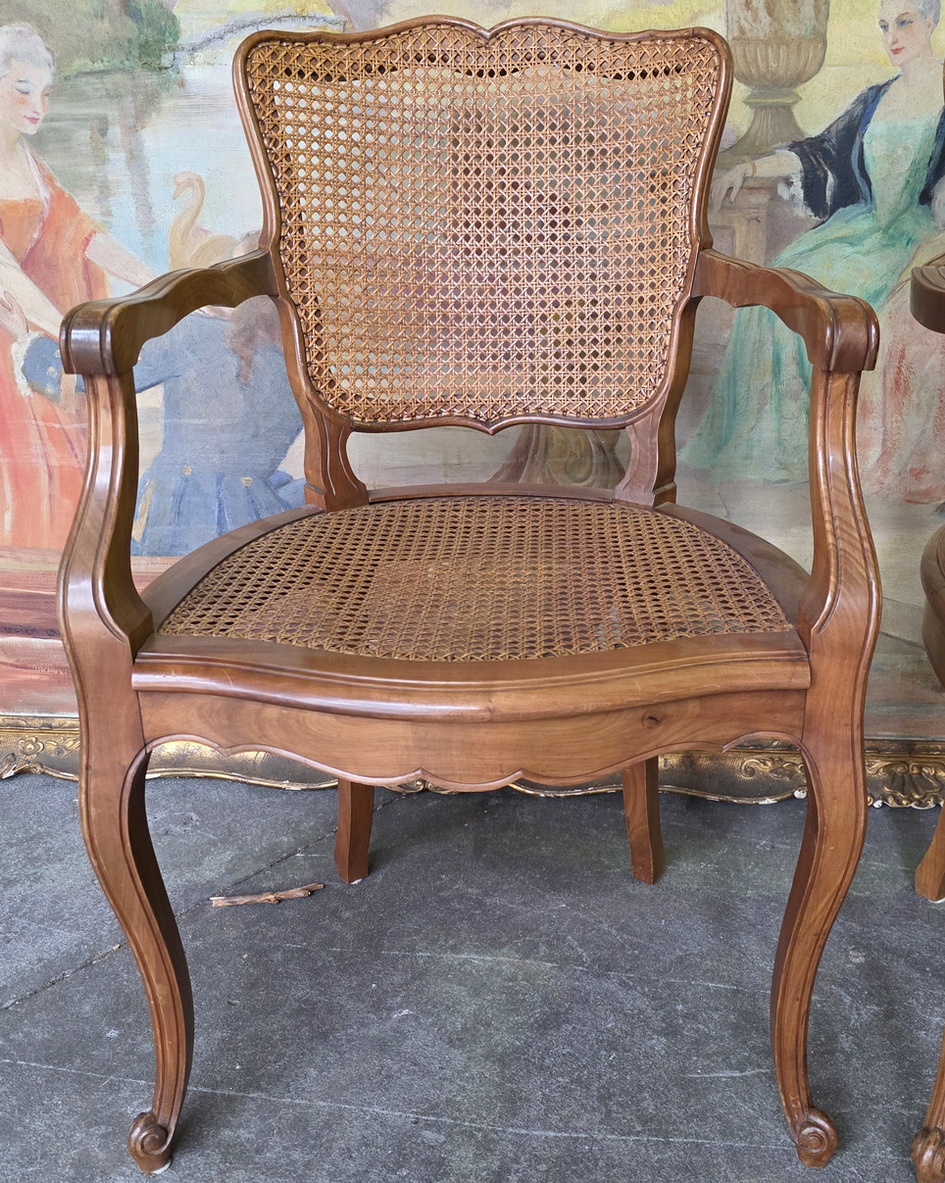 A pair of French 'Moustache' Armchairs